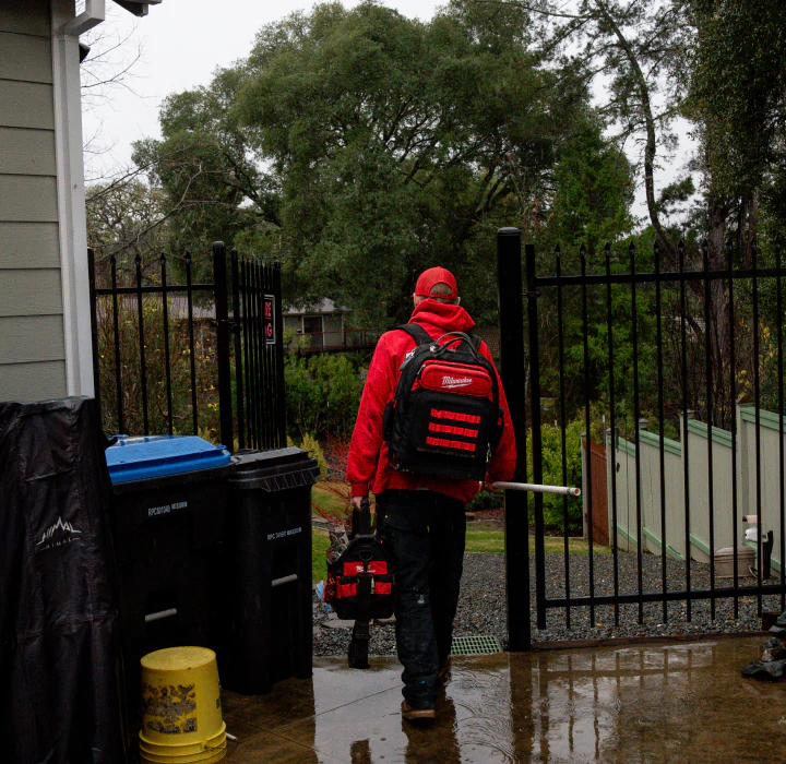 plumber leaving a house